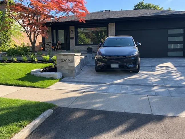 Finished front yard with address pillar and Japanese maple
